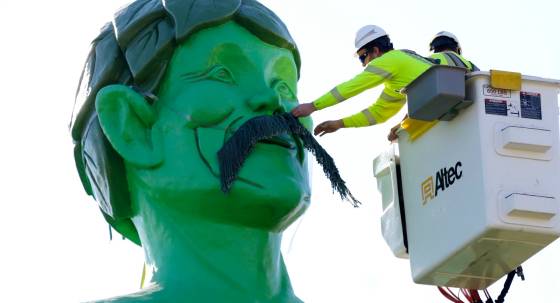 Workers install a mustache on the Jolly Green Giant for Movember (Image: AP/Andy Clayton-King)